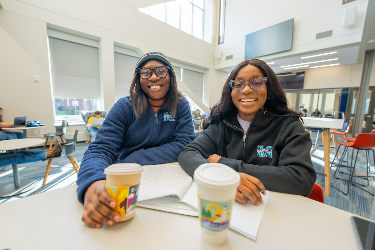 Students drink coffee from Quick Byte and study in Ferland Engineering.