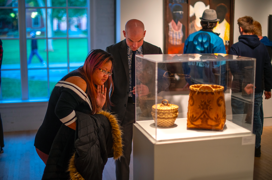 People looking at art at a live Lord Hall Gallery.