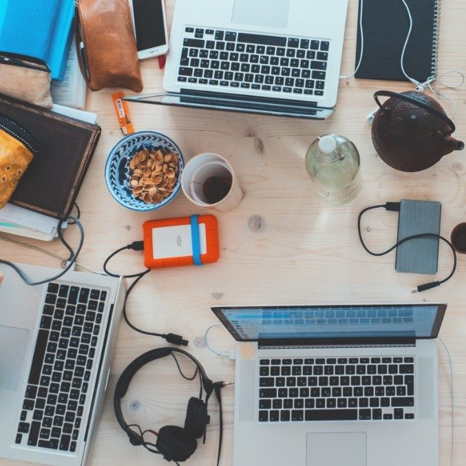 Top down photo of laptops and other technology