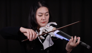Riuxin Niu, a student at the University of Maine, is playing her 3D printed violin/viola.