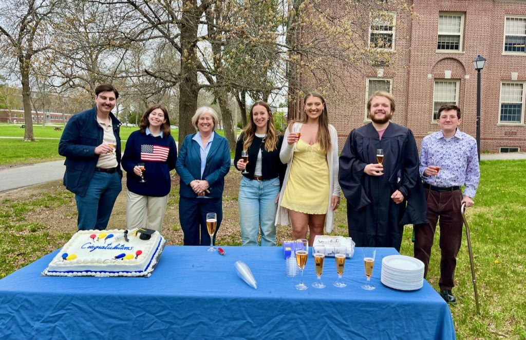 A photo of Joan Ferrini Mundy with history graduates