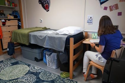 Student studying at dorm desk