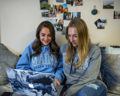 female umaine students using internet-