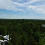 View of the Howland forest canopy from the top of the main tower, with instrumentation in sight