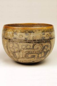 Ceramic Bowl, painted and incised with intricate designs.