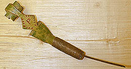 Green knife with scroll finial