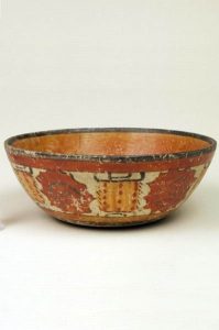 A small painted bowl with intricate designs