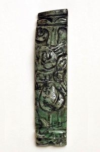 An intricately-carved bead of jade. 