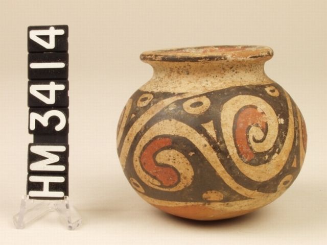 Cocle miniature polychrome ceramic jar. Designs of "Y" motifs and abstract claws within spirals.