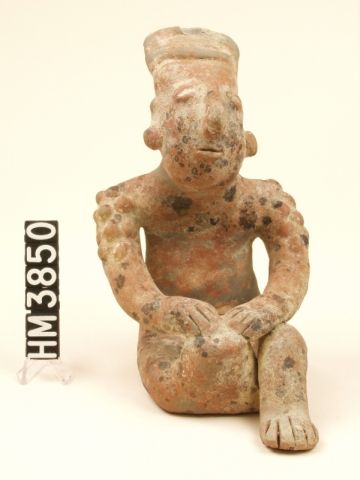 Image of ceramic figure with bumps all over their skin