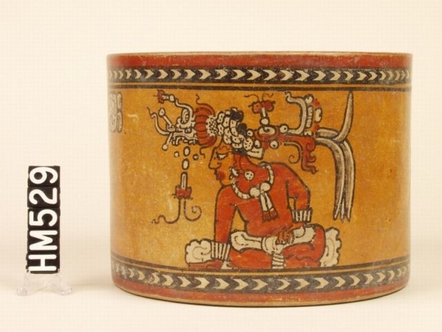 Maya vase with image of important person wearing elaborate headdress.