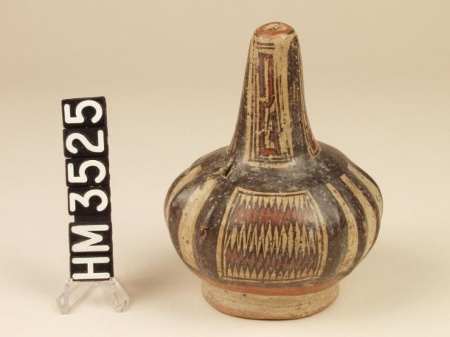 Cocle miniature polychrome ceramic bottle. Pica Pica variety. A narrow-mouthed vessel modeled after a gourd, probably used as a snuffer. Red bands with jagged edges on the side panels indicate the boa motif.