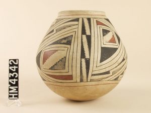 Polychrome jar with highly stylized animal and geometric designs
