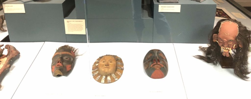 Masks in a museum exhibit.