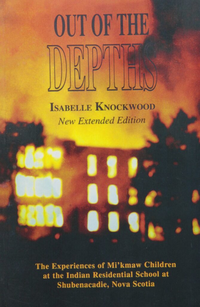 Book cover featuring a blurry picture of a building on fire.