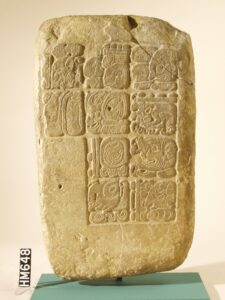 Image of a stone carved with Maya glyphs