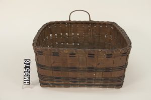 Image of a large, square shaped basket with round handles. 