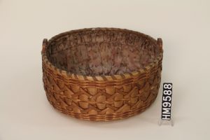 Image of a round sewing basket with a fabric lining.