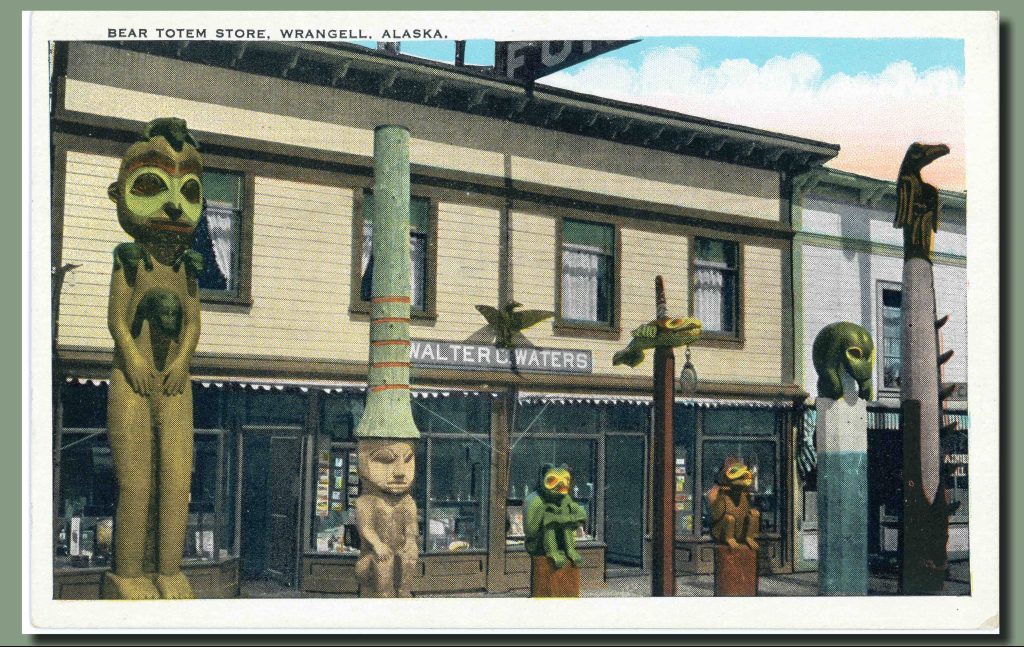 A postcard that features a color illustration of the Bear Totem Store's storefront with seven totem of varying heights and styles. 