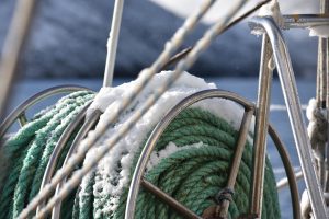 Snow on a wheel of green rope