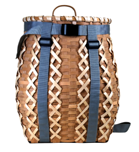 Image of a pack basket with gray straps. The basket had decorative criss-crossed woven elements.