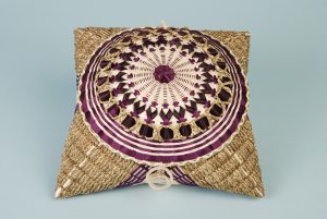 An intricate handkerchief basket with dark purple and lavender.