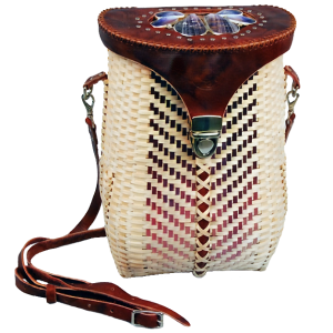 Image of basket shaped like pack basket with long leather strap. Cover is leather and decorated with purple shells set in silver.