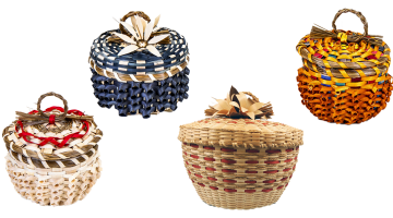 Image of four baskets on a white background. Each is ornately woven with curls and sweetgrass details. Two have sweetgrass braid loop handles and two have brown ash flowers on the cover.