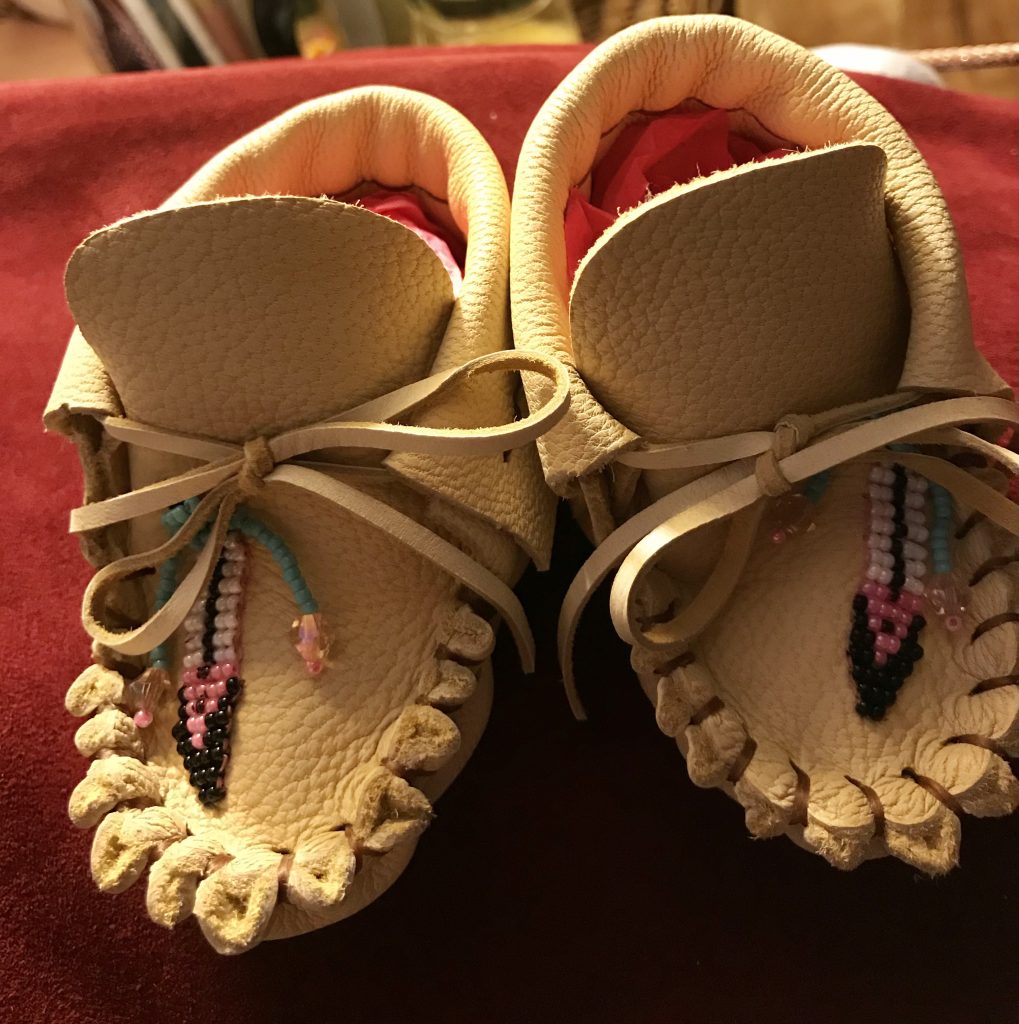 Image of baby moccasins with beaded details.