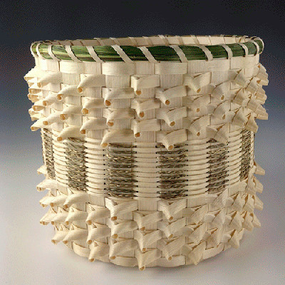 Image of basket with intricate curls and sweetgrass details.