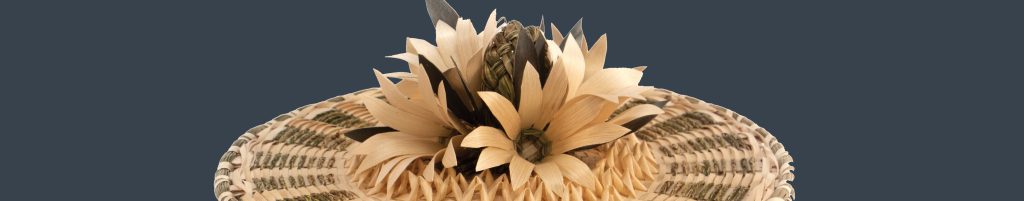 Detail image of a basket cover with brown ash flowers.