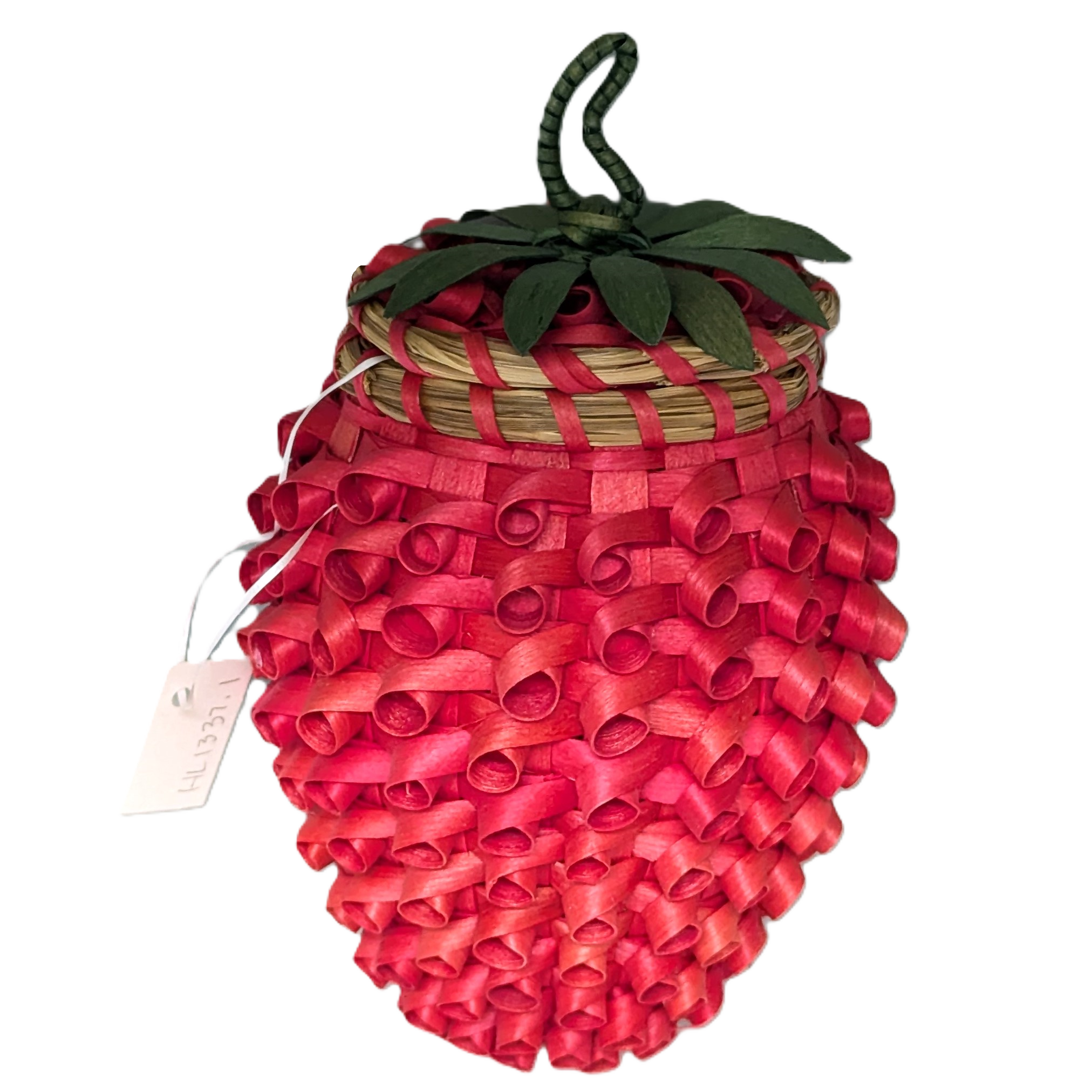 Image of basket in the shape of a strawberry, bright red with curls. Cover has green leaves and a green loop.