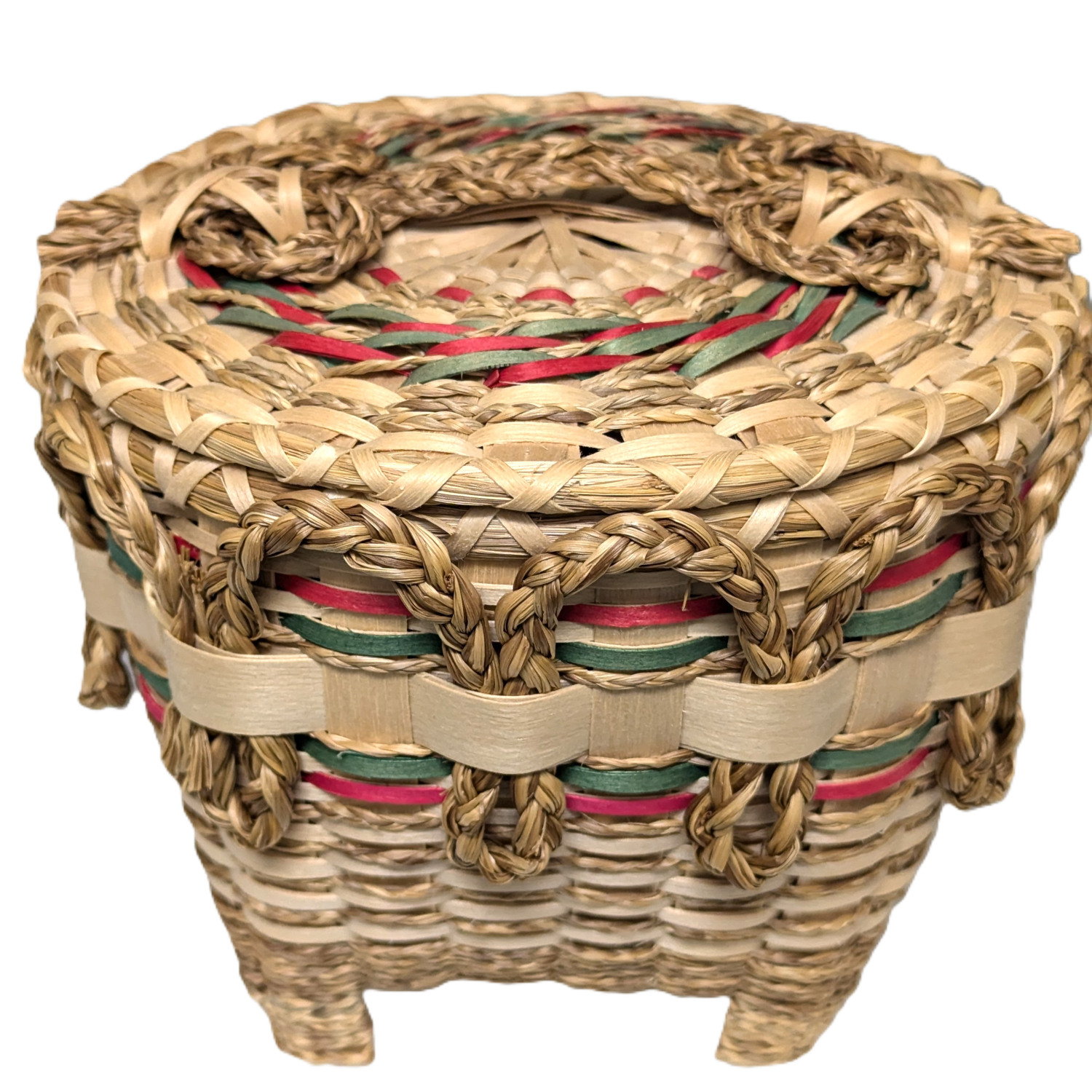Intricate basket with braided sweetgrass, red and green details, and feet.