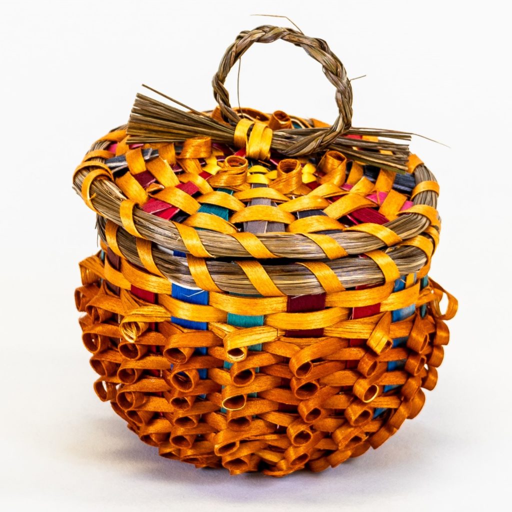 Image of small orange basket with curls.