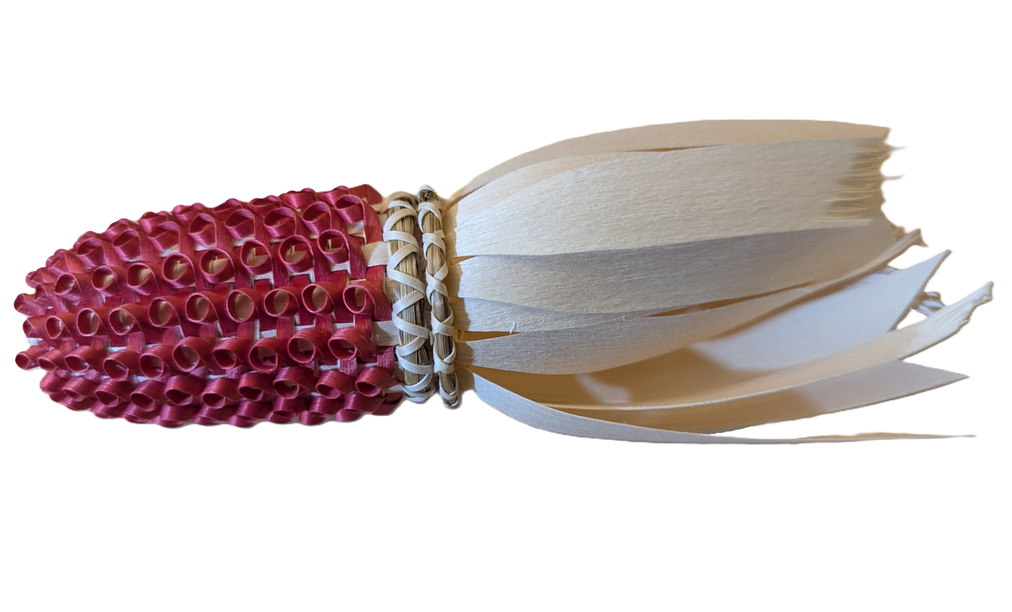 Image of basket in form of small cob of red corn with curls forming the kernals.