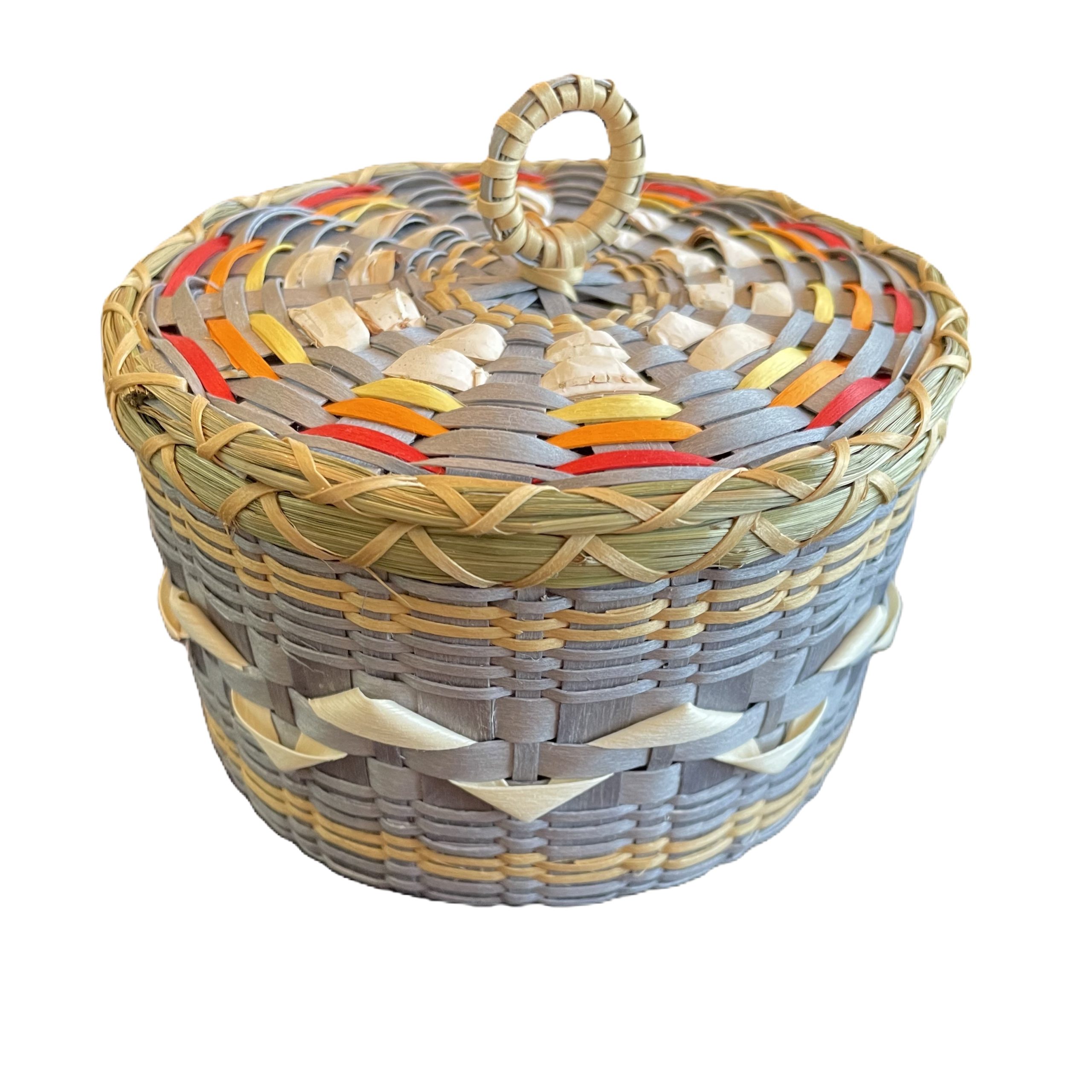 Image of colorful basket with white birchbark details.
