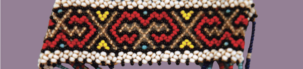 Detail image of a beaded object with red, yellow, and gold beads.