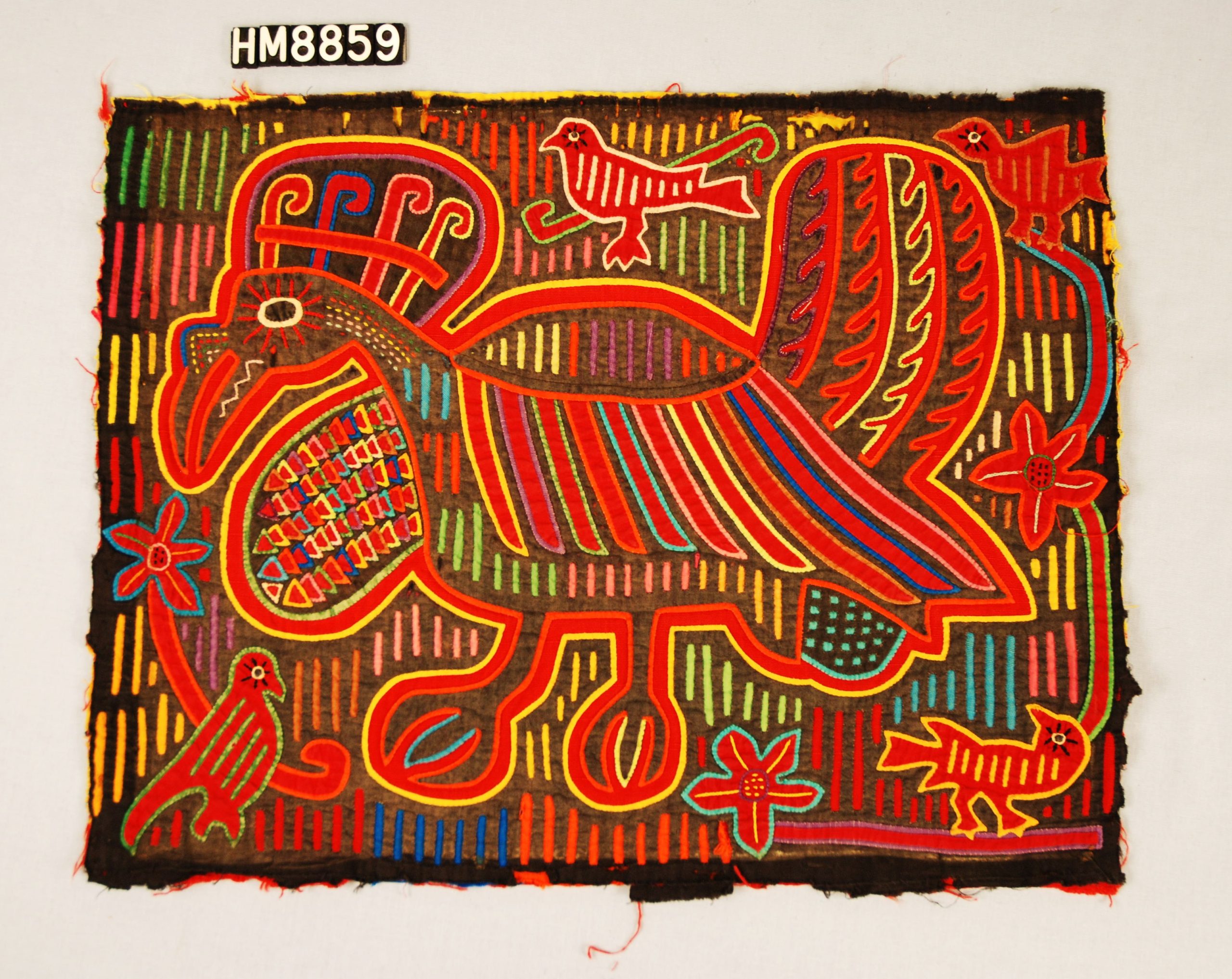 Rectangular fabric depicting colorful, stylized bird with crest and wattle on a background of lines and surrounded by four other birds and scattered flowers.