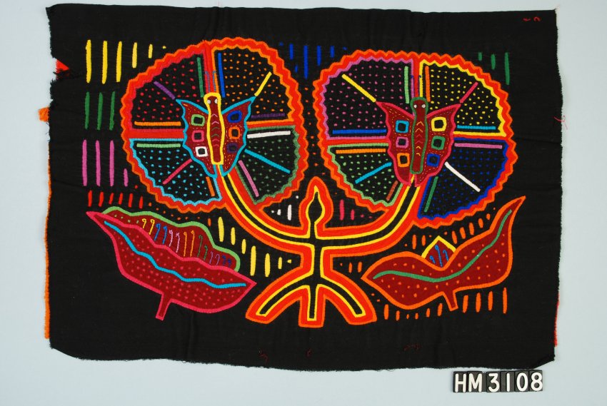 Black rectangular fabric object with vibrant, colorful floral and butterfly motifs.