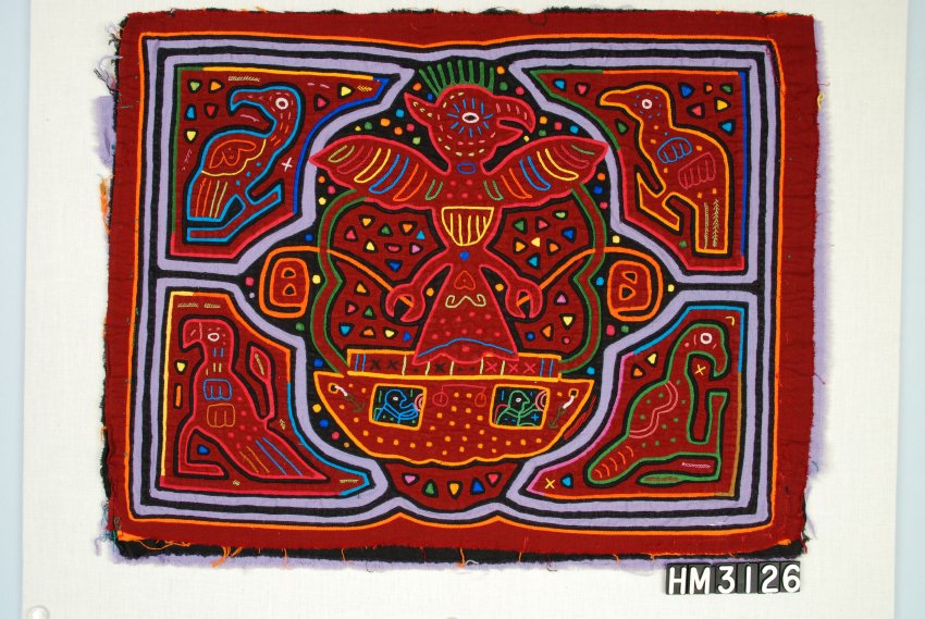 Rectangular fabric object decorated with bird designs in the center and each of the four corners.