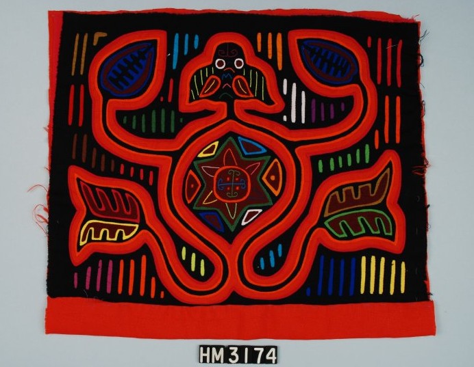 Rectangular fabric object with red floral elements and colorful linear decorations on black background.