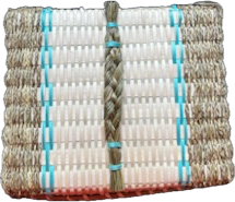 Top view of a square basket with a braided grass handle and light blue details.