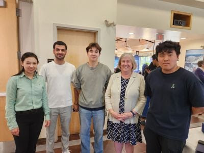 President Ferrini-Mundy with ISA officers from left to right Zahra Farahmand (treasurer), Sharif Abed (vice president), Kaidar Donenbayev (president) and Yongjoon "Justin" Choi (secretary)