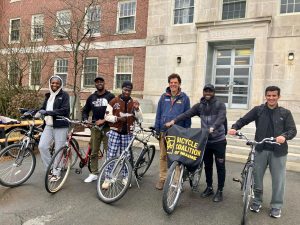 Six people standing with their bicycles