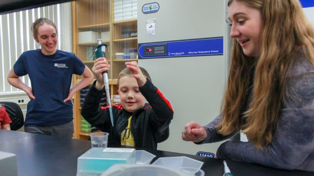 pipette child in lab