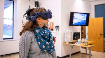 Image of woman wearing VR goggles