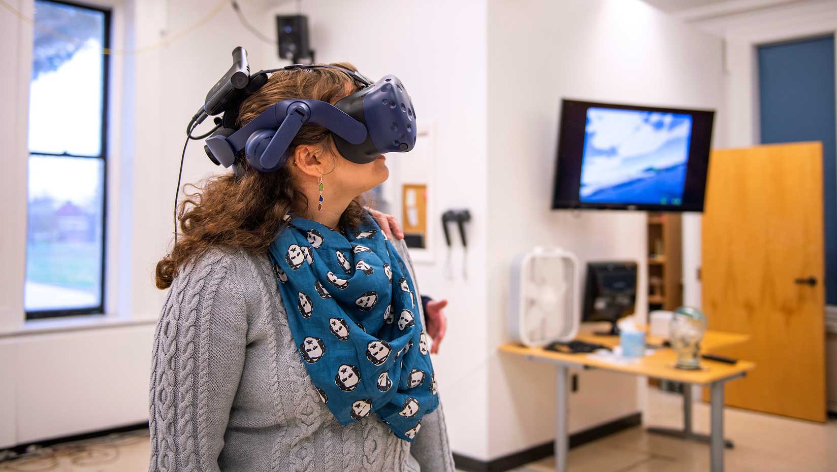 Image of woman wearing VR goggles