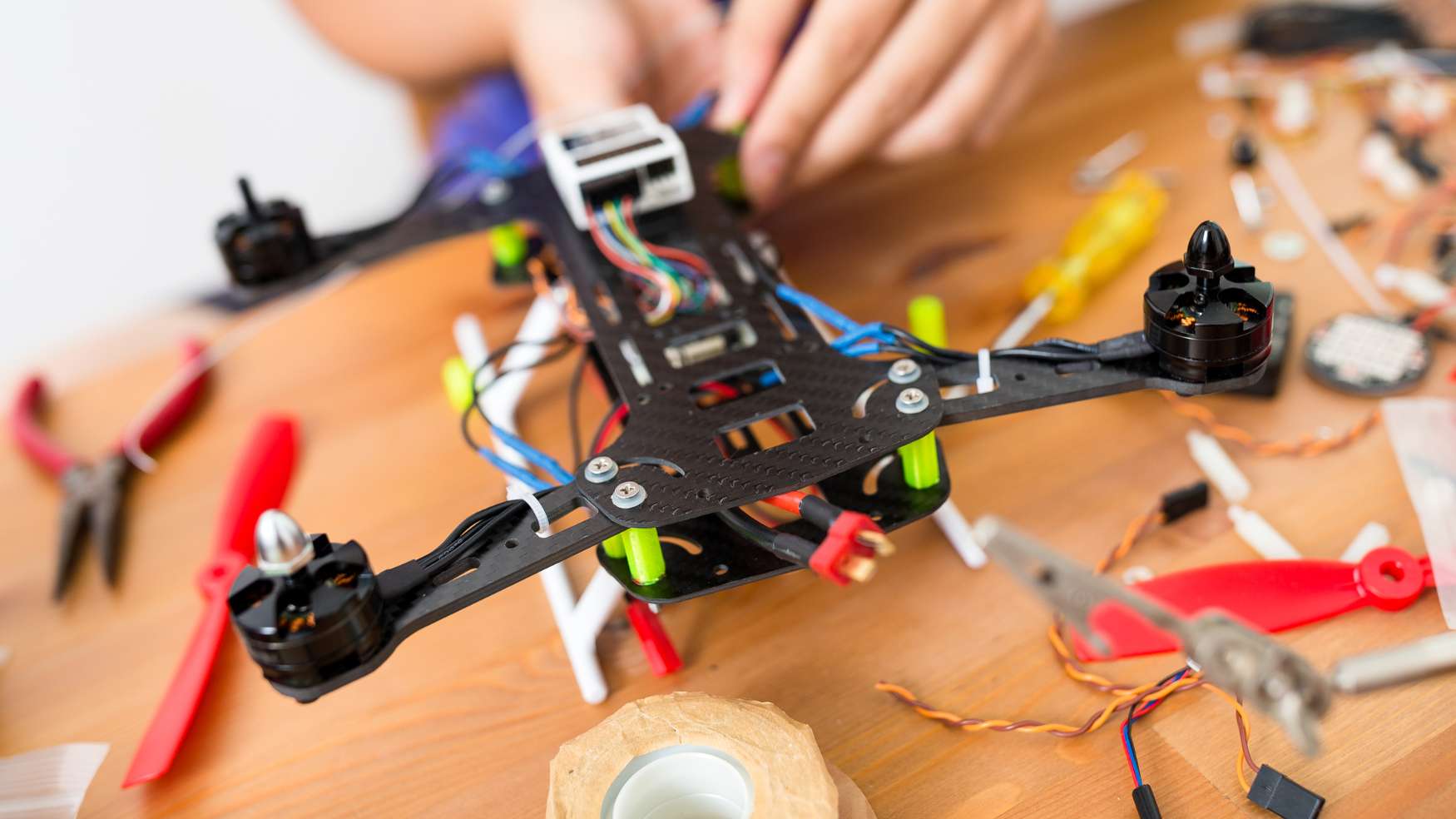 Image of person building a drone.