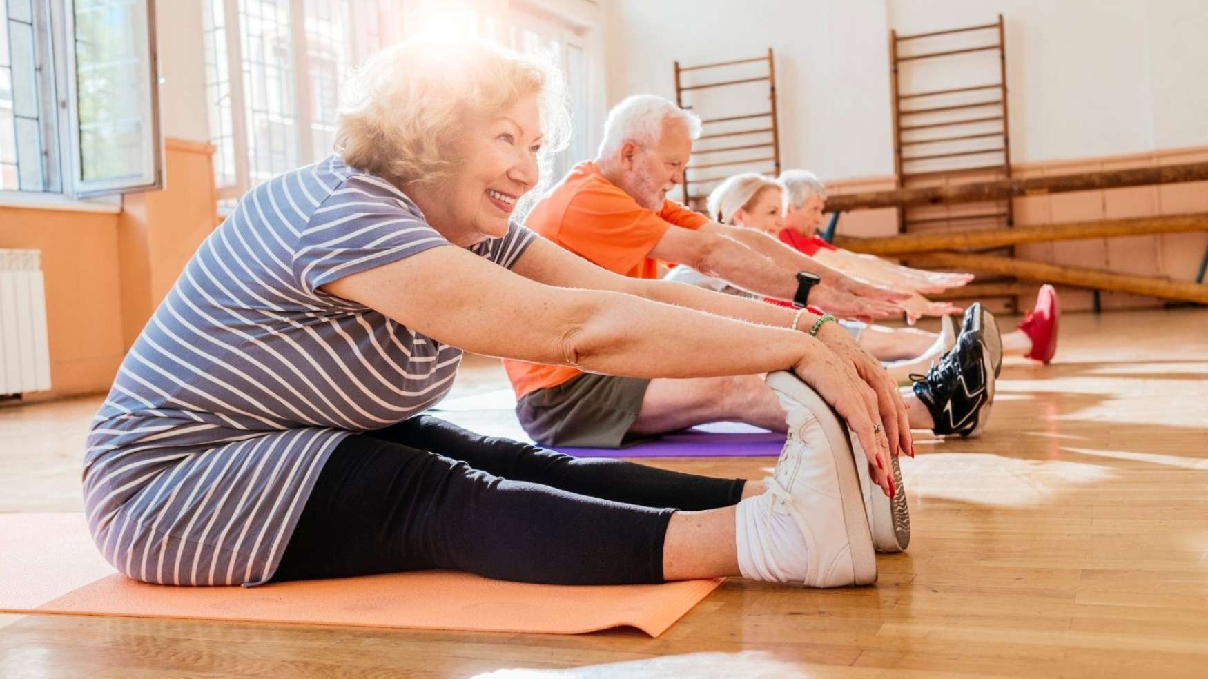 Image of older adults stretching.