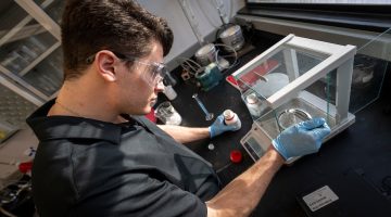 Student in a chemical engineering lab works to develop a biomedical device